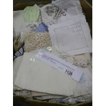 A mixed lot of vintage household textiles including embroidered linens, table cloths, napkins etc.