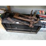 An old 5 drawer tool box and an old blacksmiths spring vice