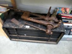 An old 5 drawer tool box and an old blacksmiths spring vice