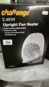 A boxed Challenge 2.4kkw upright fan heater.