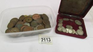 A mixed lot of old coins including some silver.