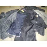 A quantity of men's suit jackets, 2 piece suits, various styles and sizes.