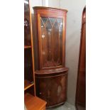 A mahogany astragal glazed corner cabinet.