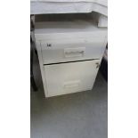 A filing cabinet with keys.