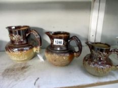 A set of 3 saltglaze graduated jugs