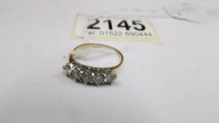 An 18ct yellow gold diamond ring, size M half, total 2.9 g.