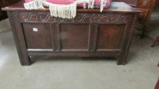 A large carved oak coffer. ****Condition report**** 129cm x 51cm x 66cm.