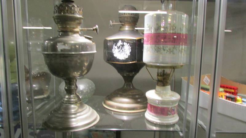 Four old oil lamp bases. - Image 2 of 2