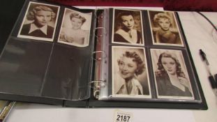 Three albums of movie star postcards (approximately 280).