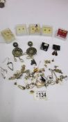 A mixed lot of earrings including some gold and silver.