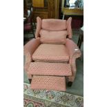 A fully reclining wing arm chair, in good condition but would benefit from a clean.