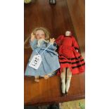 An Armand Marseille bisque doll No. 971 and a china head dolls house doll.