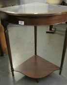 A corner table with glass top.