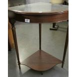 A corner table with glass top.