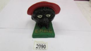 A novelty cast metal EMBC save and smile money box.