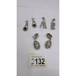 2 pairs of pendant earrings and a pair of clip on pendant earrings.