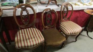 A pair of Victorian cabriole leg dining chair with a matching nursing chair.