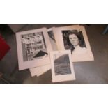 A quantity of unframed photographs.