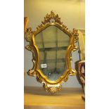 A gilt framed mirror.