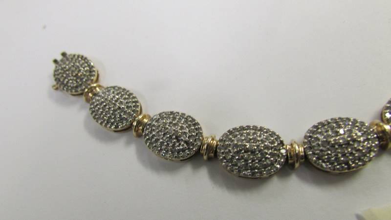 A 9ct gold and diamond bracelet. - Image 3 of 4