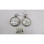 2 open faced silver pocket watches.