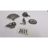 A collection of circa 1950's brooches in silver including an unusual fan brooch stamped NBs,