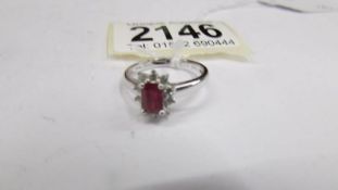 An 18ct gold 20 pt diamond / 75 pt ruby ring, size M, total 3.3 g.