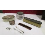 2 silver backed brushes, a silver mounted comb, a silver lidded powder bowl,
