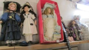 Seven porcelain collector's dolls.