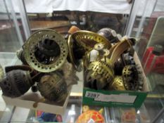 A quantity of oil lamp burners and galleries.