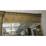 A gilded bevel edged overmantel mirror with top figural frieze.