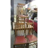 A draw leaf table and 4 chairs.