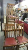 A draw leaf table and 4 chairs.