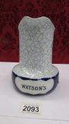 A Watson's blue band whiskey water jug.