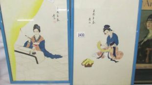 A pair of Japanese Geisha paintings.