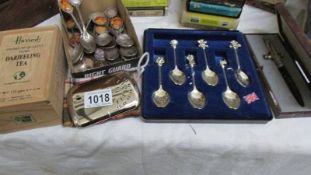 A box of commemorative teaspoons, a box of Charles & Diana teaspoons etc.