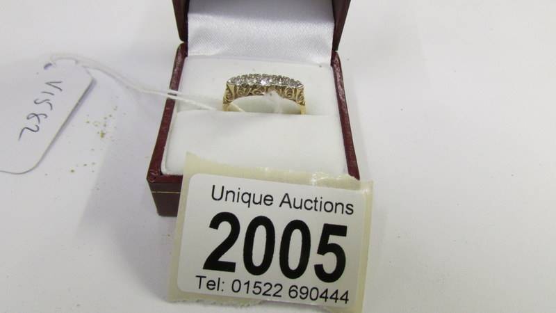 An 18ct 5 stone vintage yellow gold diamond ring, size N half.