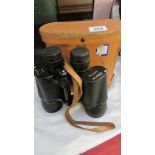 A cased pair of binoculars.