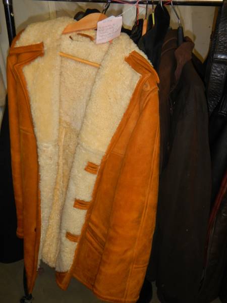 A quantity of large jackets including one sheepskin and a Taybury wax jacket, various sizes.