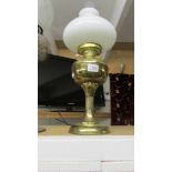 A brass oil lamp.