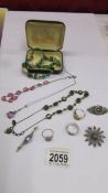 Four vintage necklaces together with three silver vintage brooches and 3 silver rings.