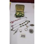 Four vintage necklaces together with three silver vintage brooches and 3 silver rings.