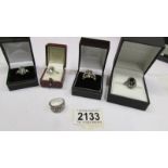 5 dress rings including one marked 9k and one silver.