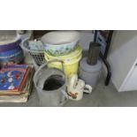 A quantity of watering cans, garden pots etc.