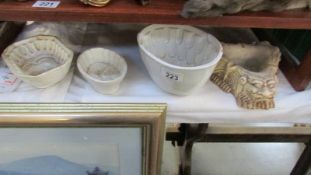 3 old jelly moulds and a gargoyle bowl.