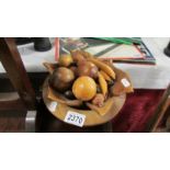 A mixed lot of wooden items including bowl, fruit etc.