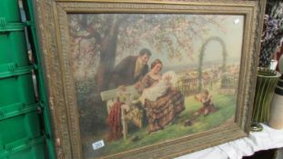 A Victorian gilt framed and glazed print of a family in a garden.