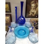 A quantity of blue glass vases and bowls etc.