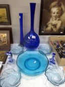 A quantity of blue glass vases and bowls etc.