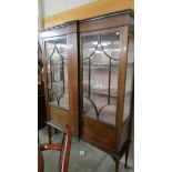 A mahogany astragal glazed display cabinet.